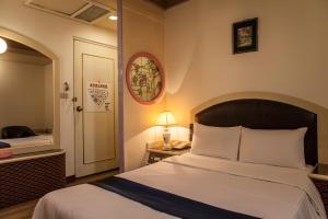 Ein Bett oder Betten in einem Zimmer der Unterkunft 真正好旅店 Good Hotel