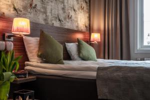 Postel nebo postele na pokoji v ubytování SPiS Hotell Naran