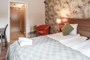 Postel nebo postele na pokoji v ubytování SPiS Hotell Naran
