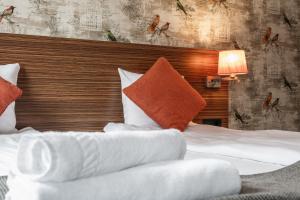 Postel nebo postele na pokoji v ubytování SPiS Hotell Naran