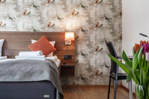 Postel nebo postele na pokoji v ubytování SPiS Hotell Naran