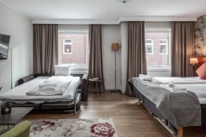 Postel nebo postele na pokoji v ubytování SPiS Hotell Naran