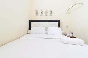 Postel nebo postele na pokoji v ubytování Krisna Hostel + 13 fotografií