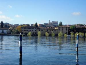 a large body of water with poles in the water at Hotel Sebino in Sarnico