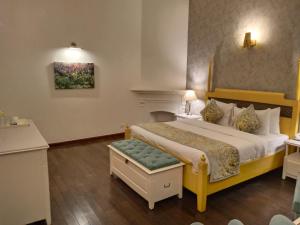 Postel nebo postele na pokoji v ubytování Hotel Pine Retreat Mallroad