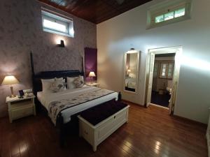Postel nebo postele na pokoji v ubytování Hotel Pine Retreat Mallroad