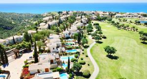 an aerial view of a resort with a golf course at 3 bedroom Villa Cardia with private pool, Aphrodite Hills Resort in Kouklia
