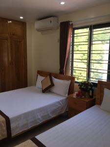 Postel nebo postele na pokoji v ubytování Minh Đức hotel