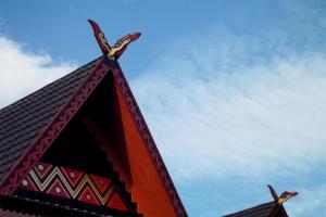 a building with a cross on the top of it at Arsela Hotel Pangkalan Bun in Pangkalan Bun