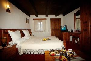Postel nebo postele na pokoji v ubytování Family hotel Makedonska Kruchma