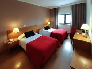 Postel nebo postele na pokoji v ubytování Hotel Durao + 27 fotografií