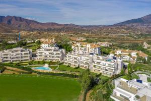 an aerial view of a resort with mountains in the background at Apartment front Line La Cala Golf Resort in La Cala de Mijas