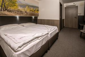 Posteľ alebo postele v izbe v ubytovaní Andante Pension & Restaurant