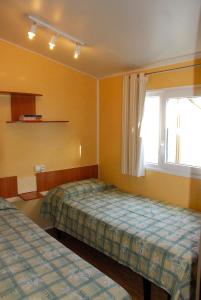 Postel nebo postele na pokoji v ubytování Bungalows Pirineus + 29 fotografií