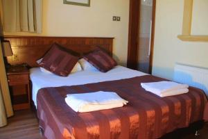 Postel nebo postele na pokoji v ubytování Altinkaya Holiday Resort + 15 fotografií