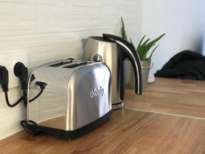 a toaster sitting on top of a kitchen counter at Swann Disney Appartement in Montévrain