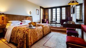 Cama ou camas em um quarto em Pousada Mosteiro de Guimaraes