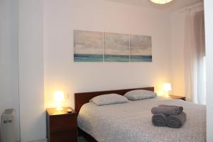 Posteľ alebo postele v izbe v ubytovaní Apartamento con Terraza a 5 min playa + 24 fotografií