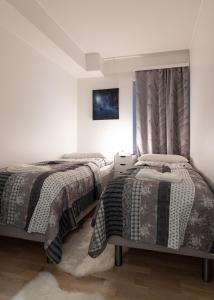 מיטה או מיטות בחדר ב-Apartment Loimu C75