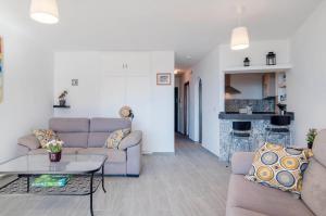 a living room with two couches and a table at Apartment Vista de Pájaro in Mijas