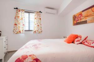 a bedroom with a bed and a window at Apartment Vista de Pájaro in Mijas +18 photos