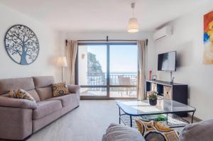a living room with a couch and a table at Apartment Vista de Pájaro in Mijas
