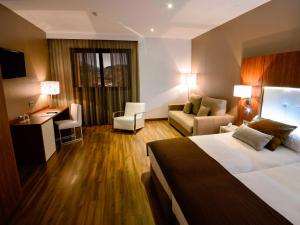Postel nebo postele na pokoji v ubytování Gran Hotel Botánicos