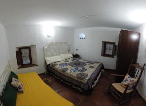 A bed or beds in a room at Molino de Simón