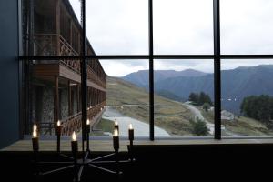 a room with a window with a view of a road at Hotel Samzeo in Omalo