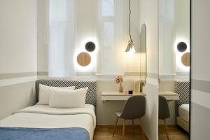 Posteľ alebo postele v izbe v ubytovaní Hotel Luxembourg
