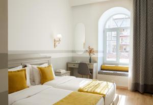 Posteľ alebo postele v izbe v ubytovaní Hotel Luxembourg