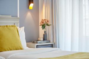 Posteľ alebo postele v izbe v ubytovaní Hotel Luxembourg