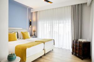 Posteľ alebo postele v izbe v ubytovaní Hotel Luxembourg