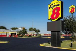 a sign for a super restaurant in a parking lot at Super 8 by Wyndham Ft Stockton in Fort Stockton