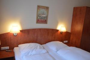 Postel nebo postele na pokoji v ubytování Hotel Wikinger Hof