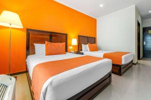 Cama o camas de una habitación en Comfort Inn Cancún Aeropuerto