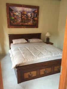 Postel nebo postele na pokoji v ubytování MALINI Homestay