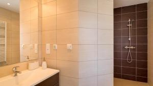 a bathroom with a shower and a sink at Sienna in Vale do Lobo +7 photos