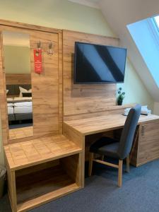 TV a/nebo společenská místnost v ubytování City-Hotel-Wolgast
