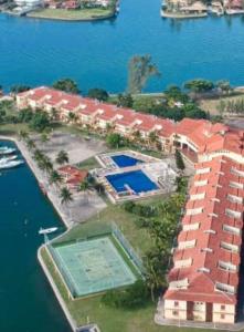 an aerial view of a building next to the water at Ilha Marinas do Canal in Cabo Frio
