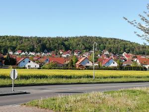 a street sign on the side of a road with a town at Ferienwohnung Quedlinburg OT Gernrode Harz in Gernrode - Harz