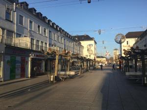 an empty street in a town with buildings at Stadtstudio Saarlouis in Saarlouis