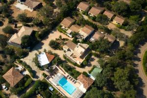 an aerial view of a house with a swimming pool at Résidence Chiar' Di Luna in Sainte-Lucie de Porto-Vecchio