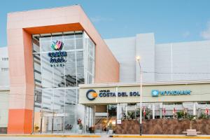 a building with a sign on the front of it at Costa del Sol Wyndham Tumbes in Tumbes