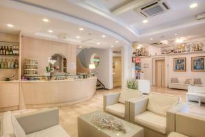 a living room with a bar in the middle at Hotel Nautico in Cattolica