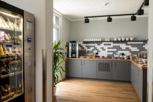 a kitchen with gray cabinets and a counter top at mk monteurzimmer eschborn in Eschborn