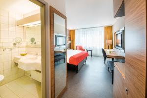 Ein Badezimmer in der Unterkunft Best Western Plus Delta Park Hotel
