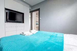 Posteľ alebo postele v izbe v ubytovaní Resort Apartamenty Klifowa Rewal 27 + 31 fotografií