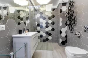 Kúpeľňa v ubytovaní Resort Apartamenty Klifowa Rewal 27