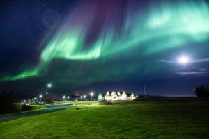an image of the northern lights in the sky at Héradsskólinn Historic Guesthouse in Laugarvatn